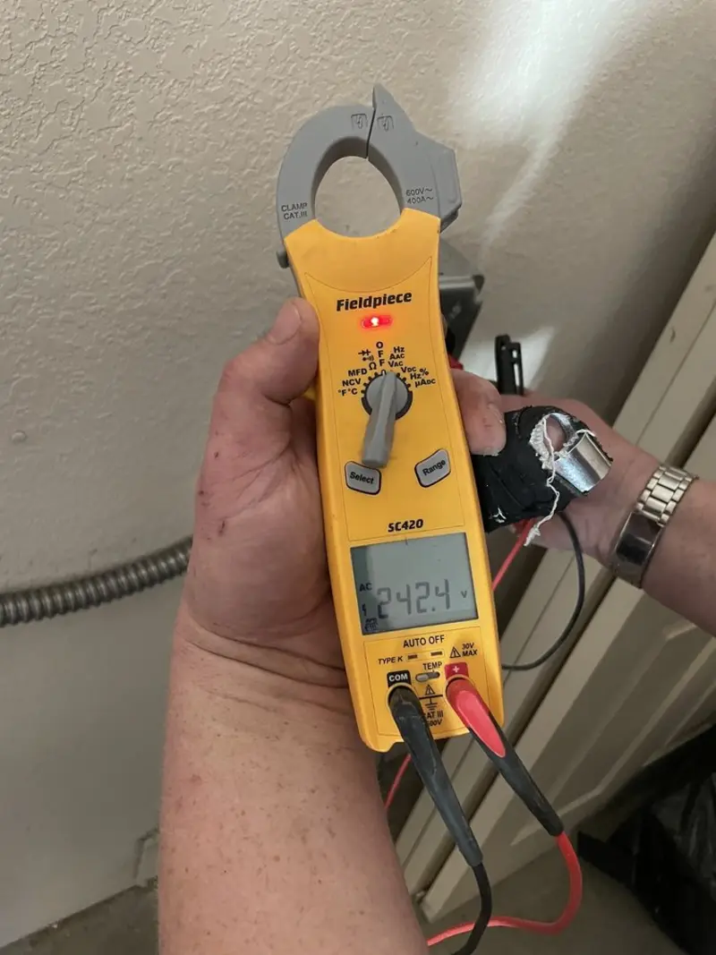 Voltage testing with clamp meter during Generator Installation in Laguna Niguel